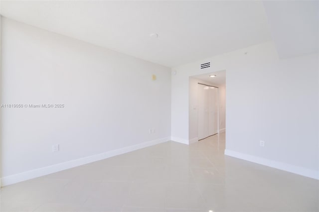 16699 Collins Ave Unit 2107, Sunny Isles Beach, FL 33160 - unfurnished room featuring baseboards and light tile patterned flooring