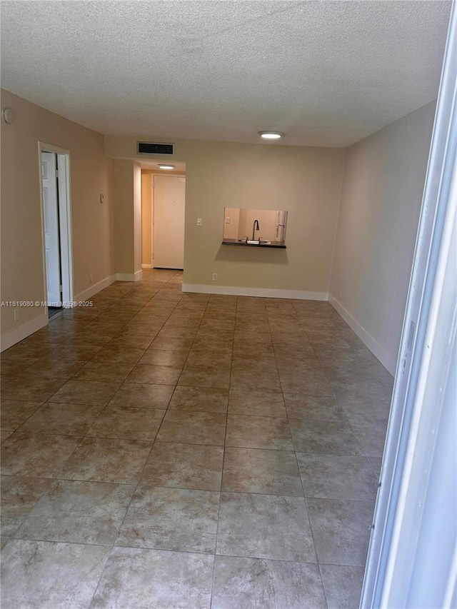 2935 NE 163rd St Unit 3P, North Miami Beach, FL 33160 - empty room with a textured ceiling