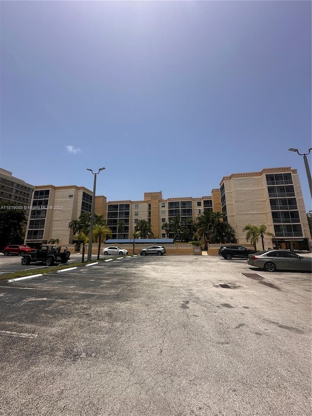 2935 NE 163rd St Unit 3P, North Miami Beach, FL 33160 - view of apartment building / complex featuring uncovered parking