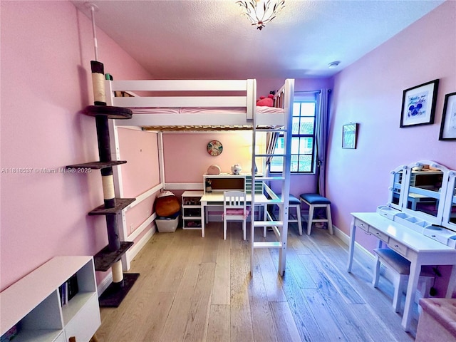119 Riverwalk Cir E, Plantation, FL 33325 - bedroom featuring hardwood / wood-style floors and a textured ceiling