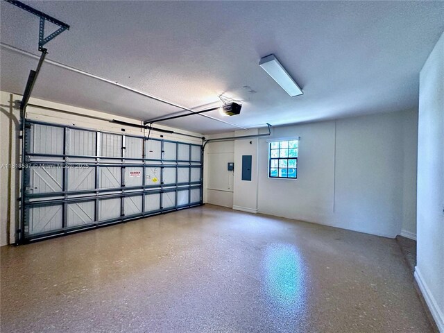 119 Riverwalk Cir E, Plantation, FL 33325 - garage featuring a garage door opener and electric panel