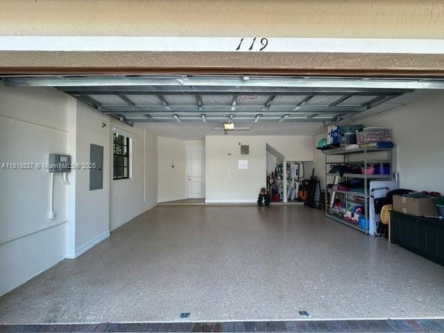 119 Riverwalk Cir E, Plantation, FL 33325 - garage featuring electric panel and a garage door opener