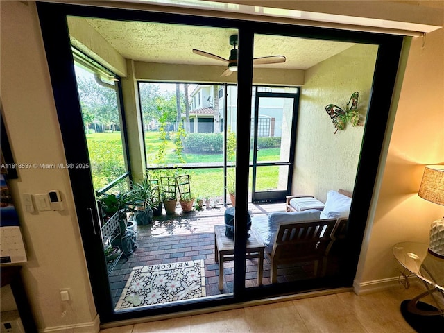 119 Riverwalk Cir E, Plantation, FL 33325 - doorway to outside featuring a ceiling fan and a textured ceiling
