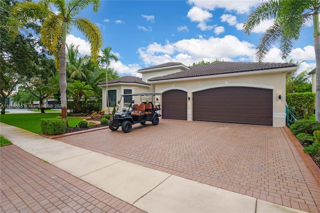 5478 SW 189th Ave, Miramar, FL 33029 - mediterranean / spanish-style house with a garage, decorative driveway, and stucco siding