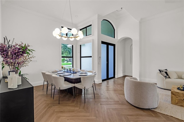 5478 SW 189th Ave, Miramar, FL 33029 - dining area with arched walkways, a chandelier, ornamental molding, and a high ceiling