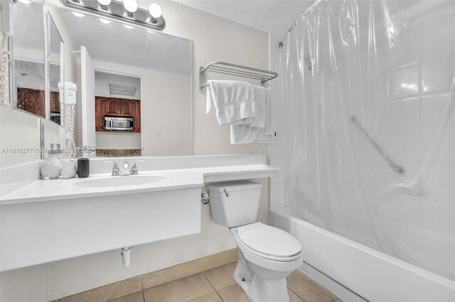 19201 Collins Ave Unit 326, Sunny Isles Beach, FL 33160 - full bathroom with toilet, shower / bathtub combination with curtain, tile patterned flooring, and vanity