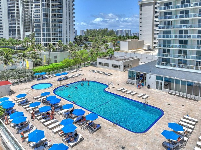 19201 Collins Ave Unit 326, Sunny Isles Beach, FL 33160 - community pool with a patio and a city view