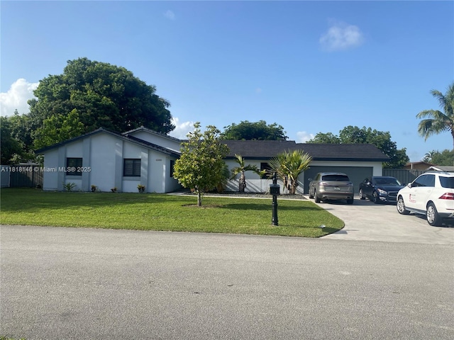 12780 SW 187th St, Miami, FL 33177 - ranch-style home with driveway, a front yard, and an attached garage