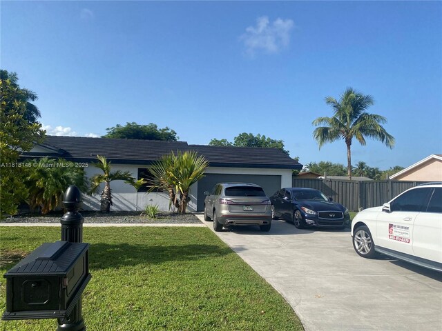 12780 SW 187th St, Miami, FL 33177 - view of front of house featuring driveway and a garage