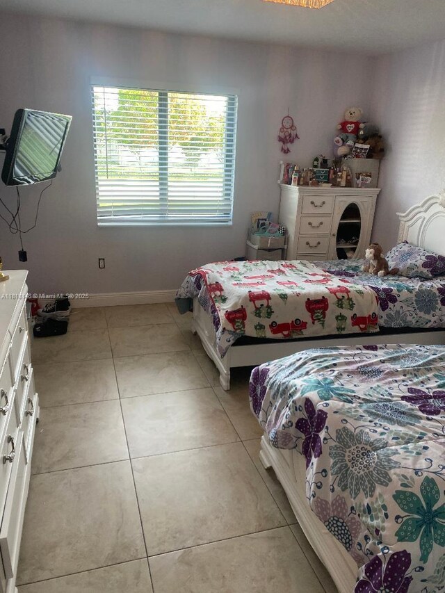 12780 SW 187th St, Miami, FL 33177 - bedroom with baseboards and light tile patterned floors