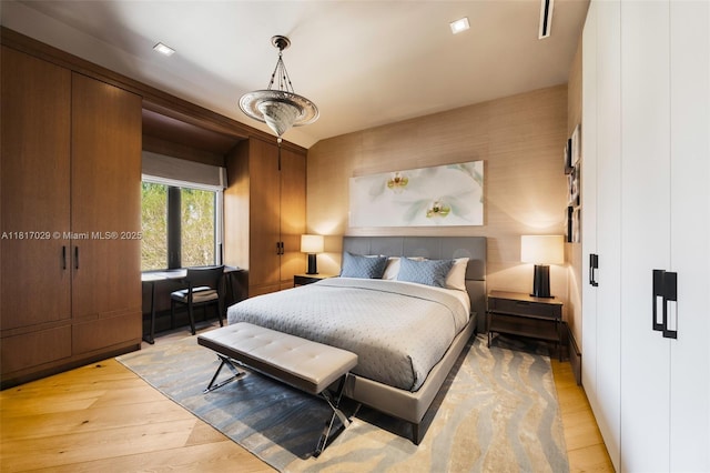 bedroom with light wood-type flooring