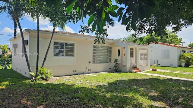 130 W 60th St, Hialeah, FL 33012 - view of front of house with crawl space and a front lawn
