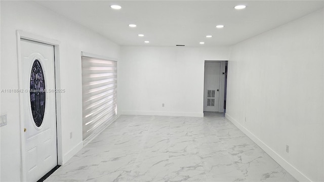 130 W 60th St, Hialeah, FL 33012 - entrance foyer with recessed lighting, light marble finish flooring, and baseboards