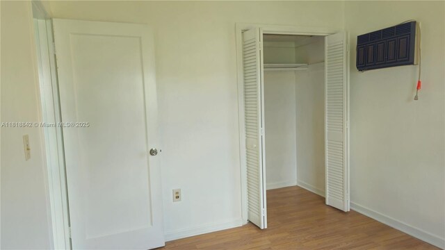 130 W 60th St, Hialeah, FL 33012 - unfurnished bedroom with wood finished floors, a closet, and baseboards