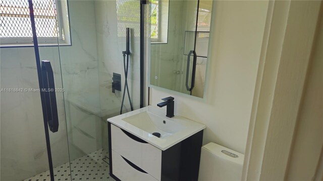 130 W 60th St, Hialeah, FL 33012 - full bathroom with vanity, a marble finish shower, and toilet