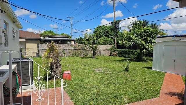 130 W 60th St, Hialeah, FL 33012 - view of yard featuring central air condition unit