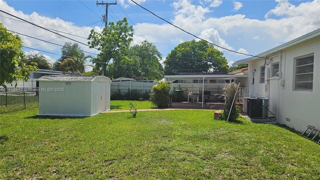 130 W 60th St, Hialeah, FL 33012 - view of yard with central AC and a patio area