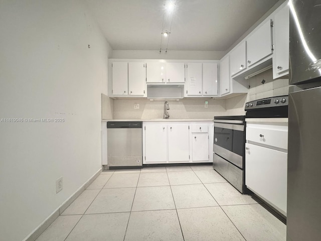 600 Three Islands Blvd Unit 620, Hallandale Beach, FL 33009 - kitchen featuring stainless steel appliances, white cabinetry, light countertops, light tile patterned floors, and open shelves