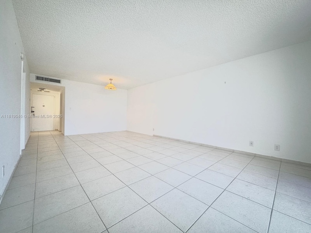 600 Three Islands Blvd Unit 620, Hallandale Beach, FL 33009 - unfurnished room with a textured ceiling and light tile patterned floors