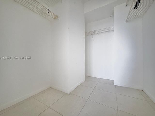 600 Three Islands Blvd Unit 620, Hallandale Beach, FL 33009 - walk in closet featuring tile patterned floors