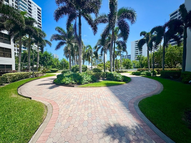 600 Three Islands Blvd Unit 620, Hallandale Beach, FL 33009 - view of community with curved driveway and a yard