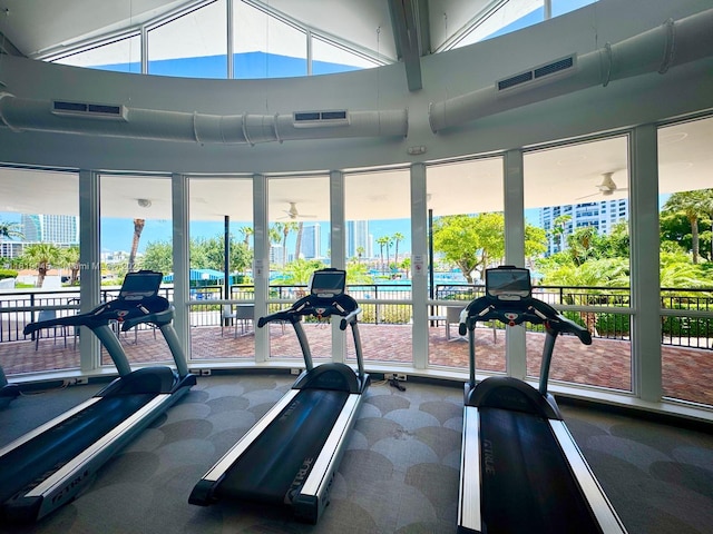 600 Three Islands Blvd Unit 620, Hallandale Beach, FL 33009 - exercise room with carpet, ceiling fan, and a high ceiling