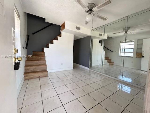 515 SW 3rd St Unit 12, Miami, FL 33130 - spare room featuring a ceiling fan, stairs, and light tile patterned floors