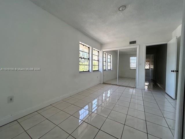 515 SW 3rd St Unit 12, Miami, FL 33130 - unfurnished room featuring light tile patterned floors and baseboards