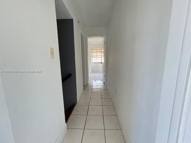 515 SW 3rd St Unit 12, Miami, FL 33130 - corridor with light tile patterned flooring and baseboards