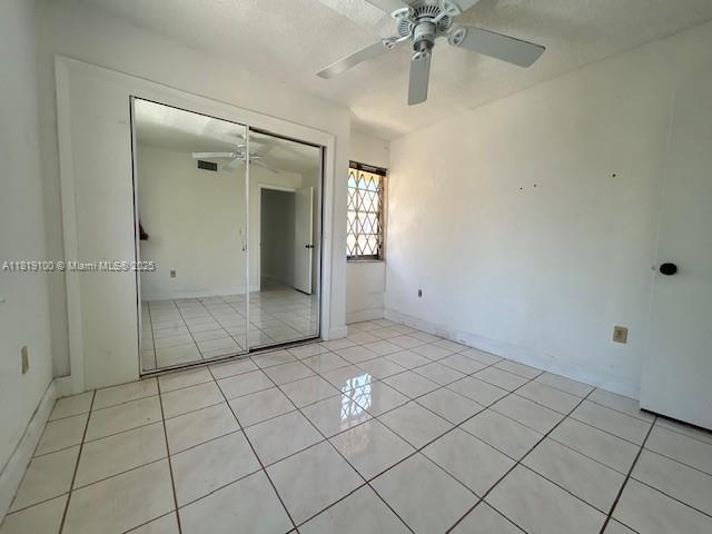 515 SW 3rd St Unit 12, Miami, FL 33130 - unfurnished room with ceiling fan, light tile patterned floors, and baseboards