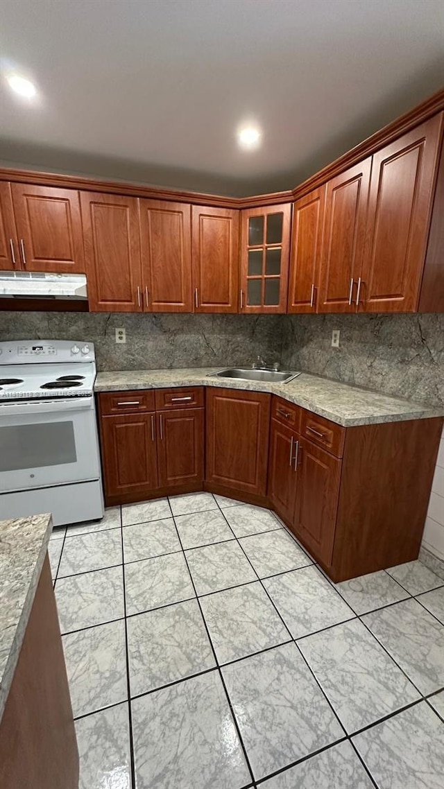 9455 W Flagler St Unit C308, Miami, FL 33174 - kitchen with electric range, under cabinet range hood, a sink, glass insert cabinets, and tasteful backsplash