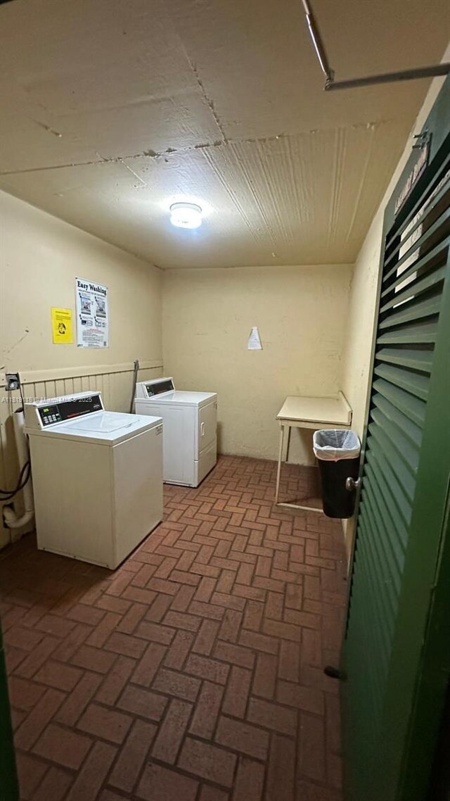 9455 W Flagler St Unit C308, Miami, FL 33174 - washroom featuring washing machine and dryer and brick patterned flooring