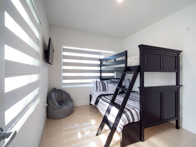 25718 SW 143rd Path, Homestead, FL 33032 - bedroom with baseboards and light tile patterned floors