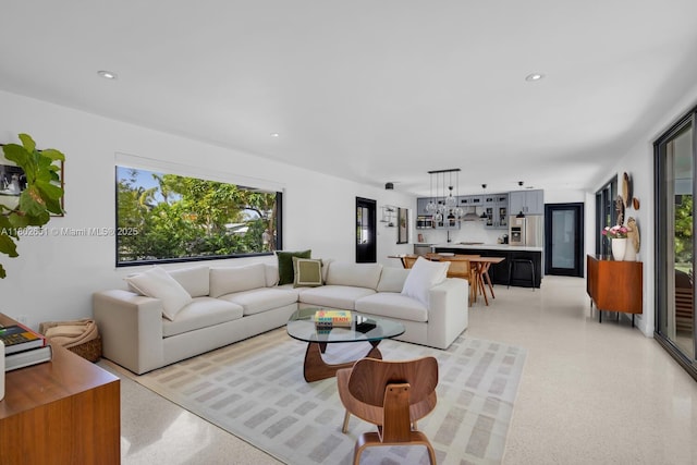 7921 SW 100th St, Miami, FL 33156 - living room featuring dark aggregate flooring and recessed lighting