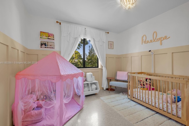 7921 SW 100th St, Miami, FL 33156 - bedroom with a decorative wall, a wainscoted wall, and speckle patterned floor