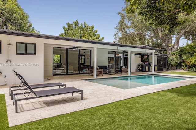 7921 SW 100th St, Miami, FL 33156 - rear view of house with outdoor lounge area, ceiling fan, a patio area, an outdoor pool, and a yard