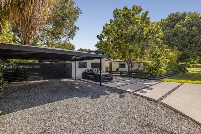 7921 SW 100th St, Miami, FL 33156 - view of front facade featuring gravel driveway