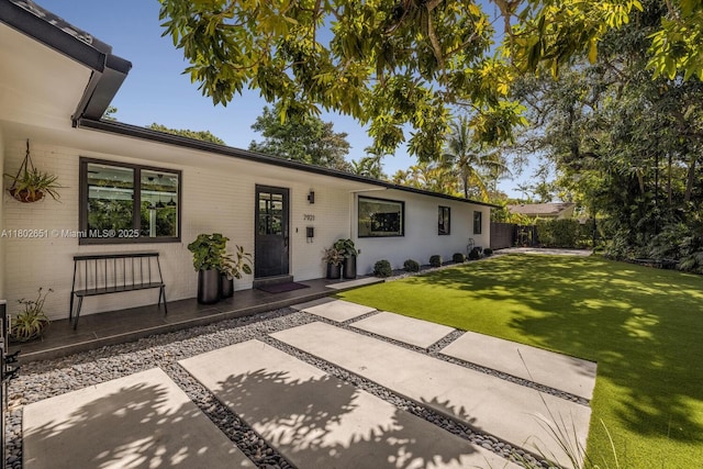 7921 SW 100th St, Miami, FL 33156 - ranch-style home featuring a patio and brick siding