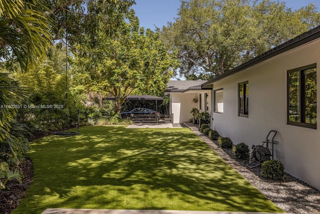 7921 SW 100th St, Miami, FL 33156 - view of green lawn with a patio
