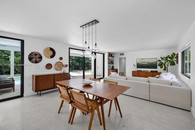 7921 SW 100th St, Miami, FL 33156 - dining space featuring dark speckled floor and plenty of natural light
