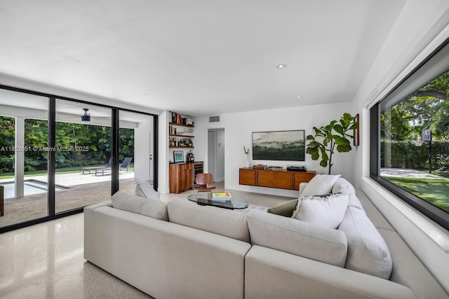 7921 SW 100th St, Miami, FL 33156 - living room featuring dark speckled floor and recessed lighting