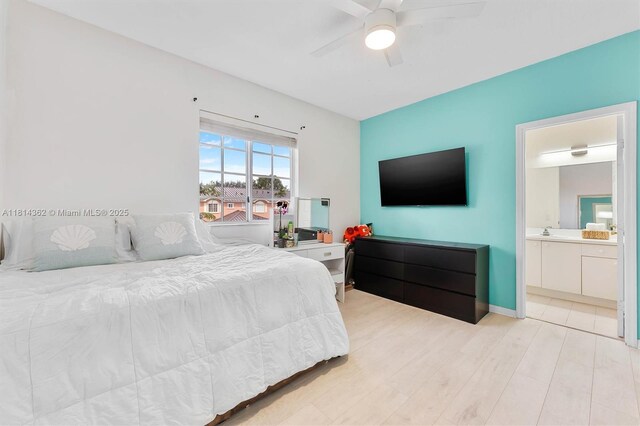 1114 NW 100th Ave, Pembroke Pines, FL 33024 - bedroom featuring light wood-style flooring, connected bathroom, and a ceiling fan