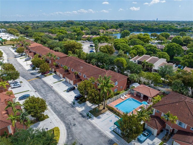 1114 NW 100th Ave, Pembroke Pines, FL 33024 - aerial perspective of suburban area featuring a pool area and a nearby body of water