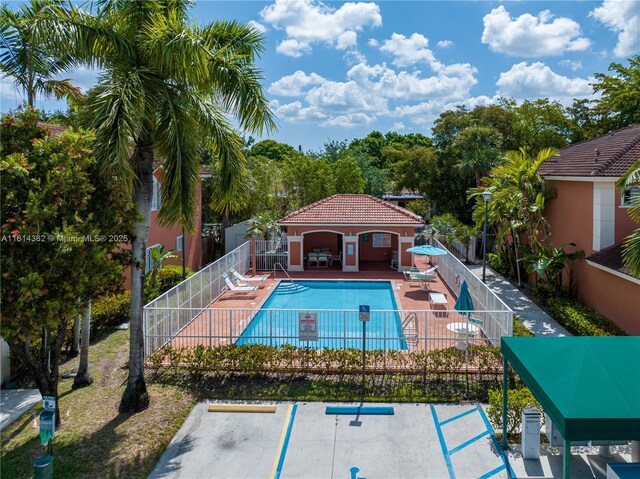 1114 NW 100th Ave, Pembroke Pines, FL 33024 - community pool featuring a patio
