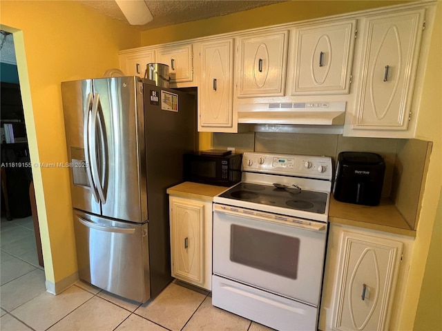 1500 NW 90th Way, Plantation, FL 33322 - kitchen featuring white range with electric stovetop, under cabinet range hood, stainless steel fridge with ice dispenser, black microwave, and light tile patterned floors