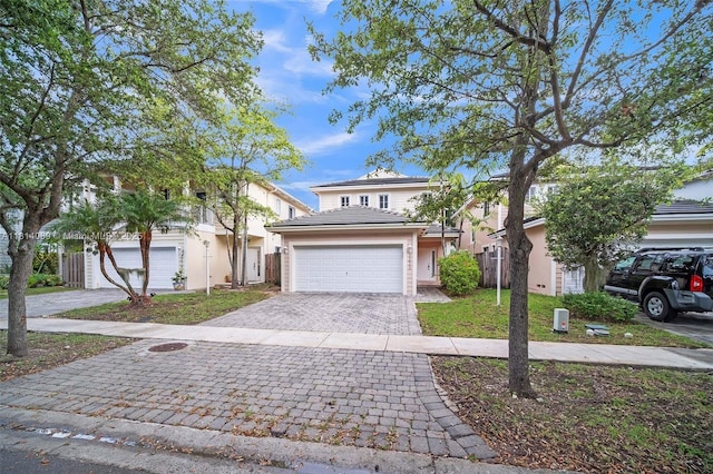 3223 SE 2nd Dr, Homestead, FL 33033 - traditional-style home featuring decorative driveway, a garage, and stucco siding