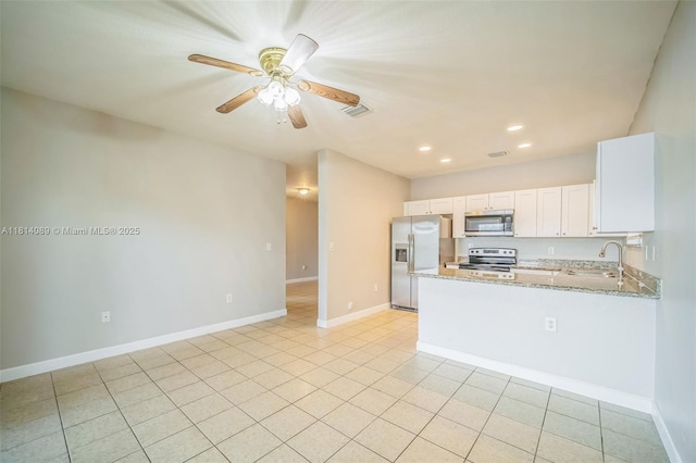 3223 SE 2nd Dr, Homestead, FL 33033 - kitchen with appliances with stainless steel finishes, light stone counters, recessed lighting, white cabinets, and ceiling fan