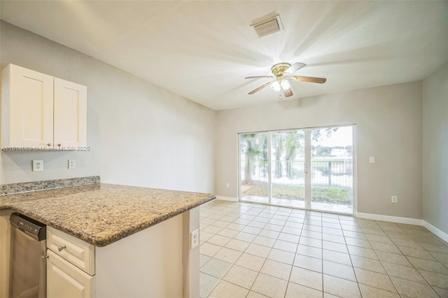 3223 SE 2nd Dr, Homestead, FL 33033 - kitchen featuring ceiling fan, light tile patterned floors, white cabinets, light stone counters, and a peninsula