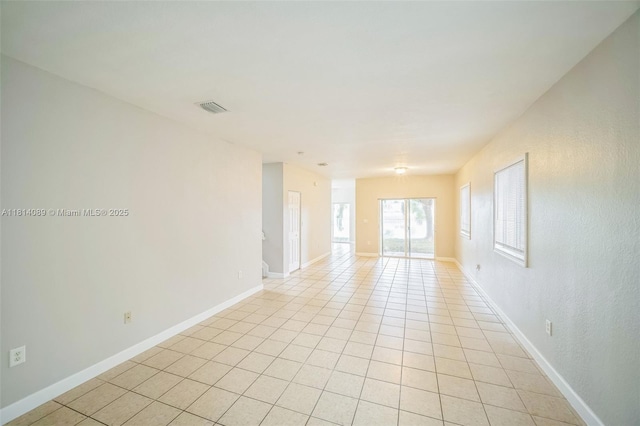 3223 SE 2nd Dr, Homestead, FL 33033 - empty room with light tile patterned floors and baseboards