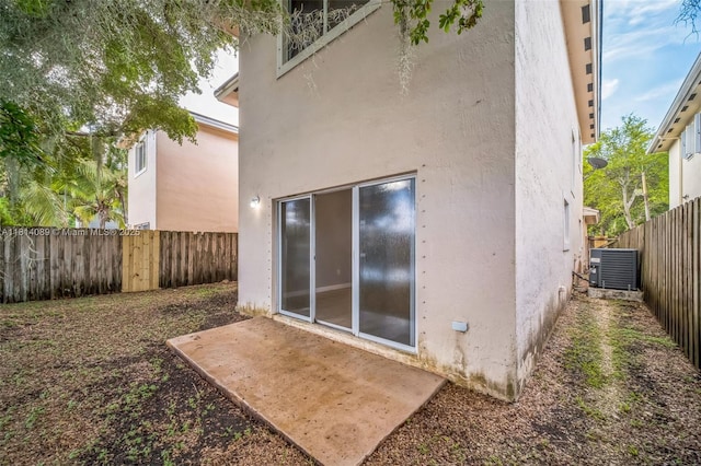 3223 SE 2nd Dr, Homestead, FL 33033 - back of house with stucco siding and a fenced backyard